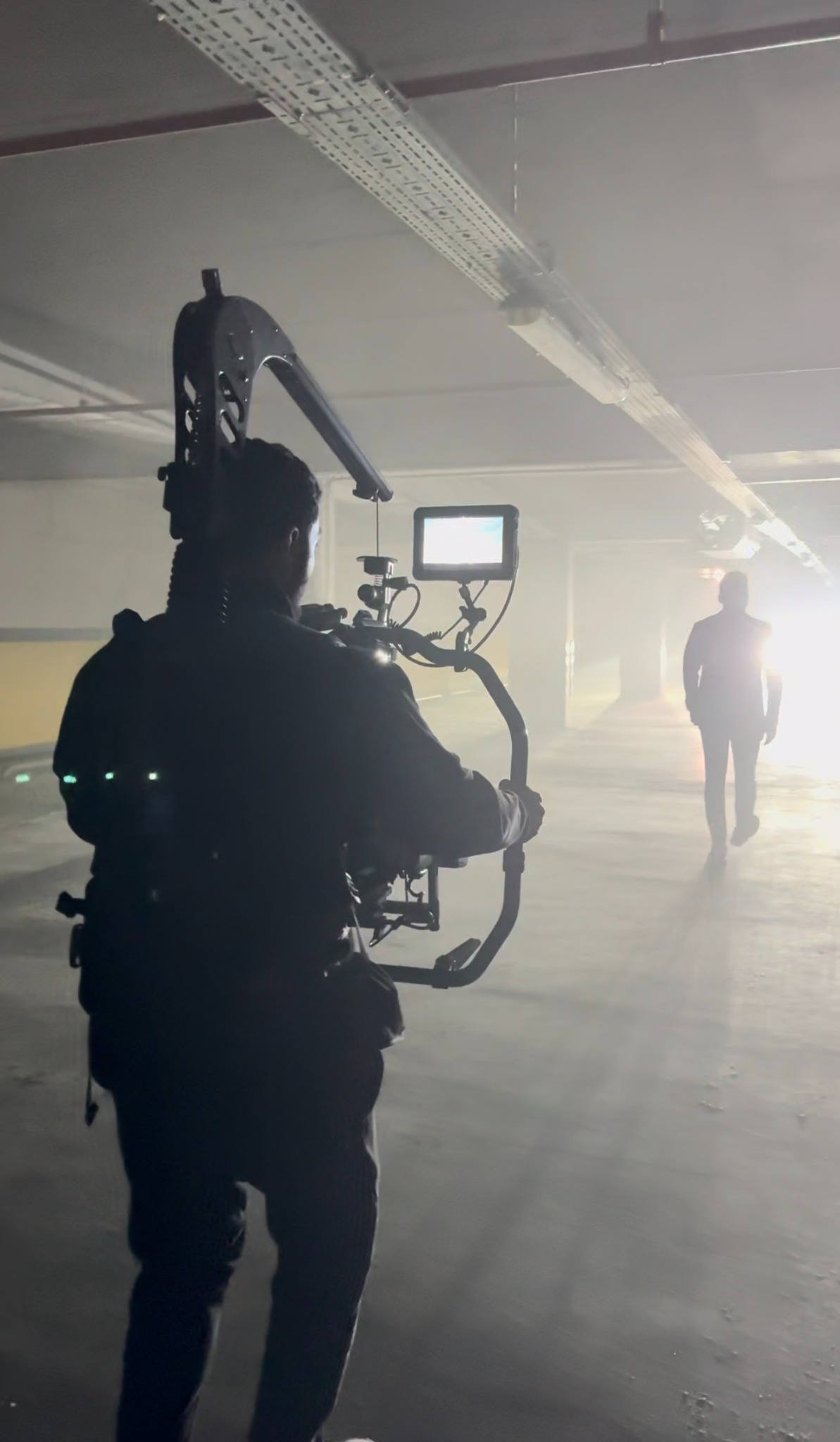 Filming in a hazy, backlit garage